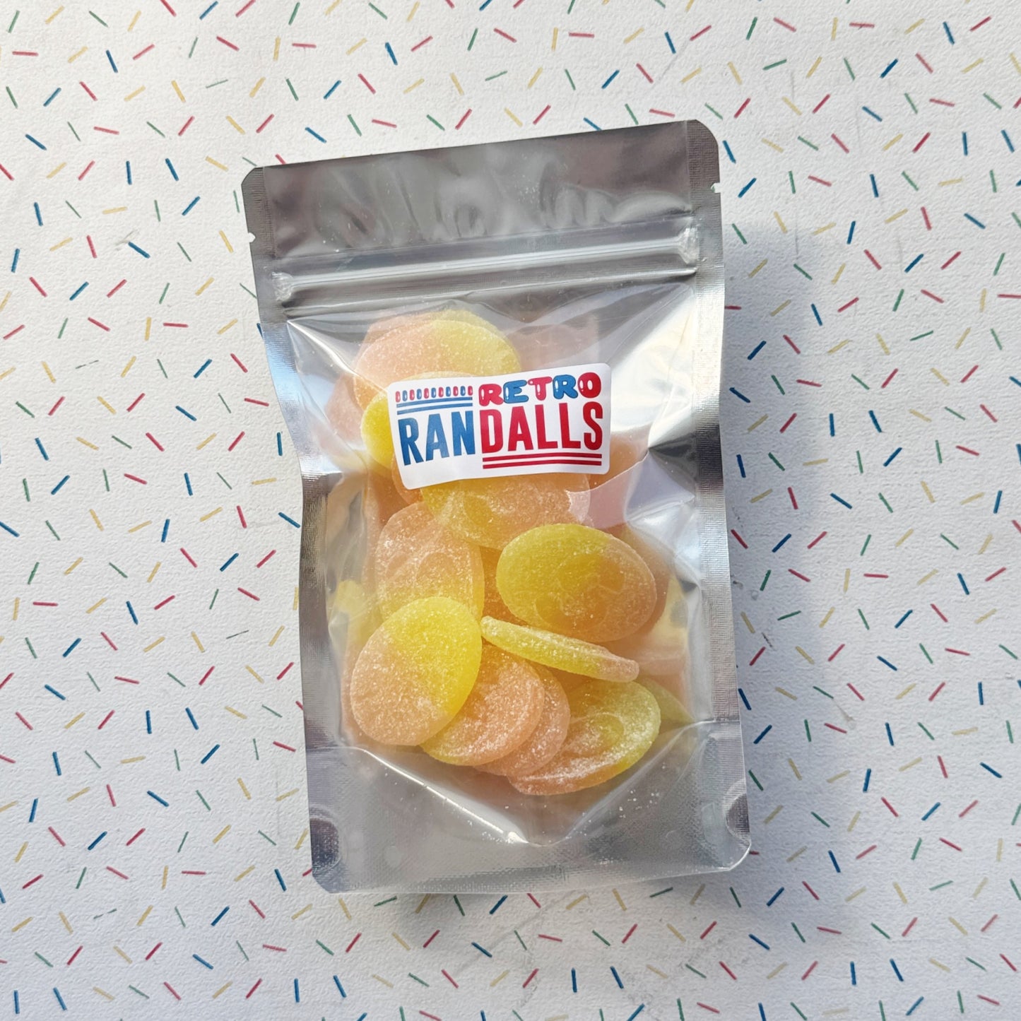 LOVALLS PASSION FRUIT SOUR OVALS - 100g (BRITISH)