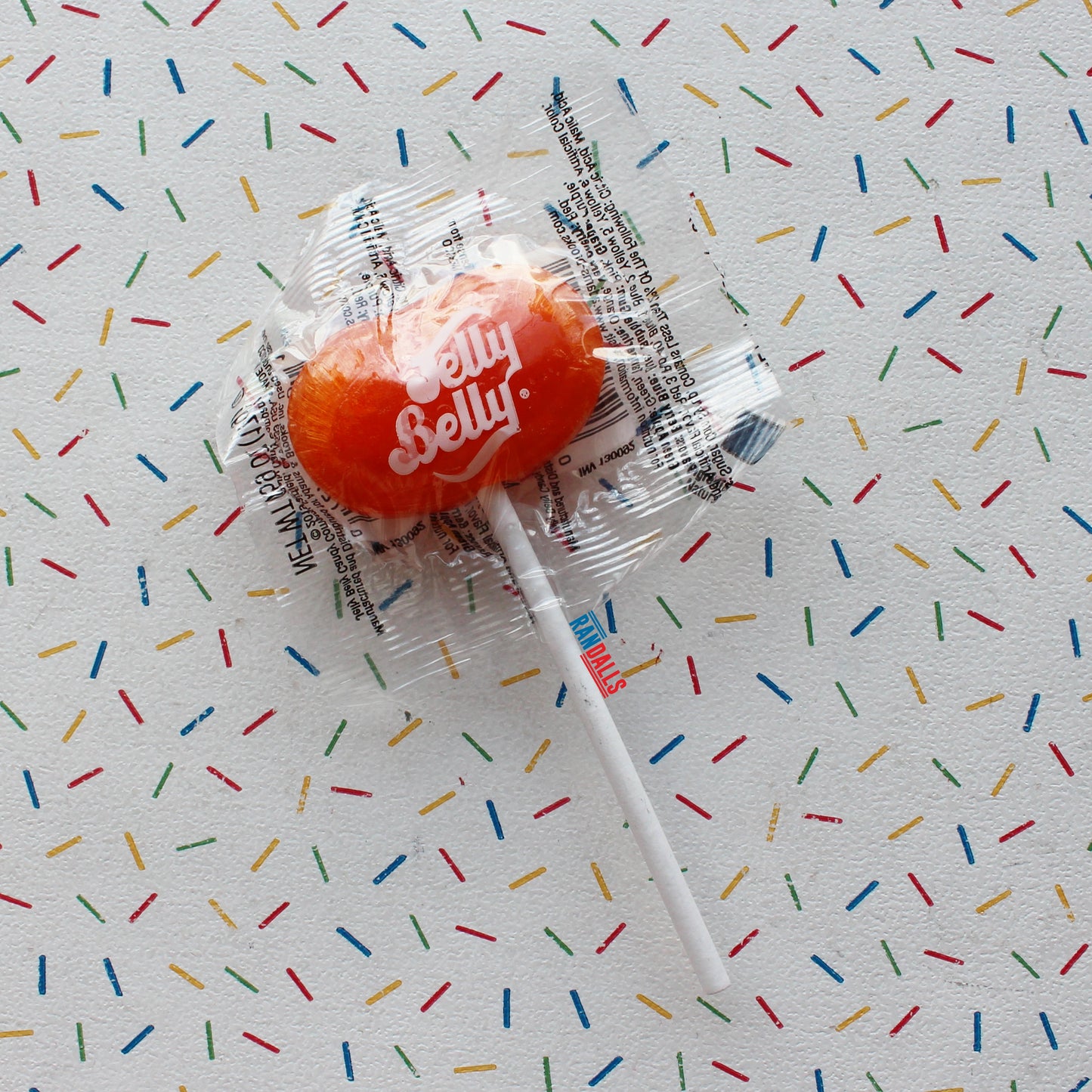 jelly belly lollipop, tangerine flavour, hard candy, hard boiled sweet